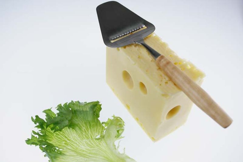 Cheese slicer with grooves